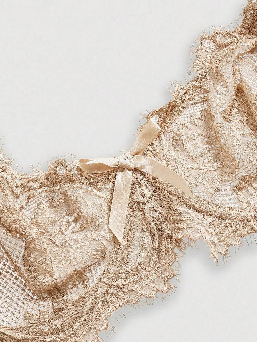 Sheer floral lace underwire triangle bra for women featuring adjustable straps and plunge cup design.