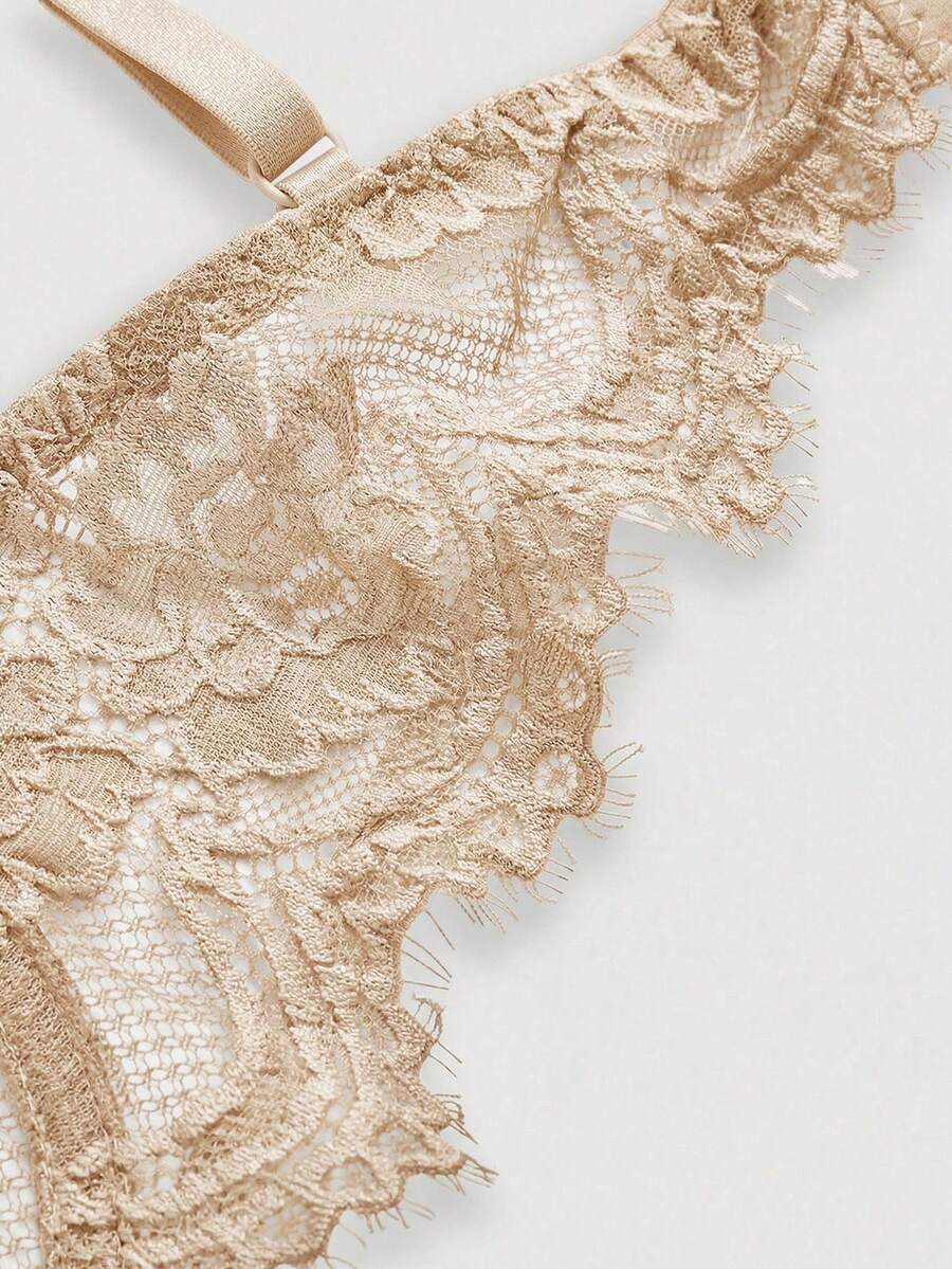 Sheer floral lace underwire triangle bra for women featuring adjustable straps and plunge cup design.