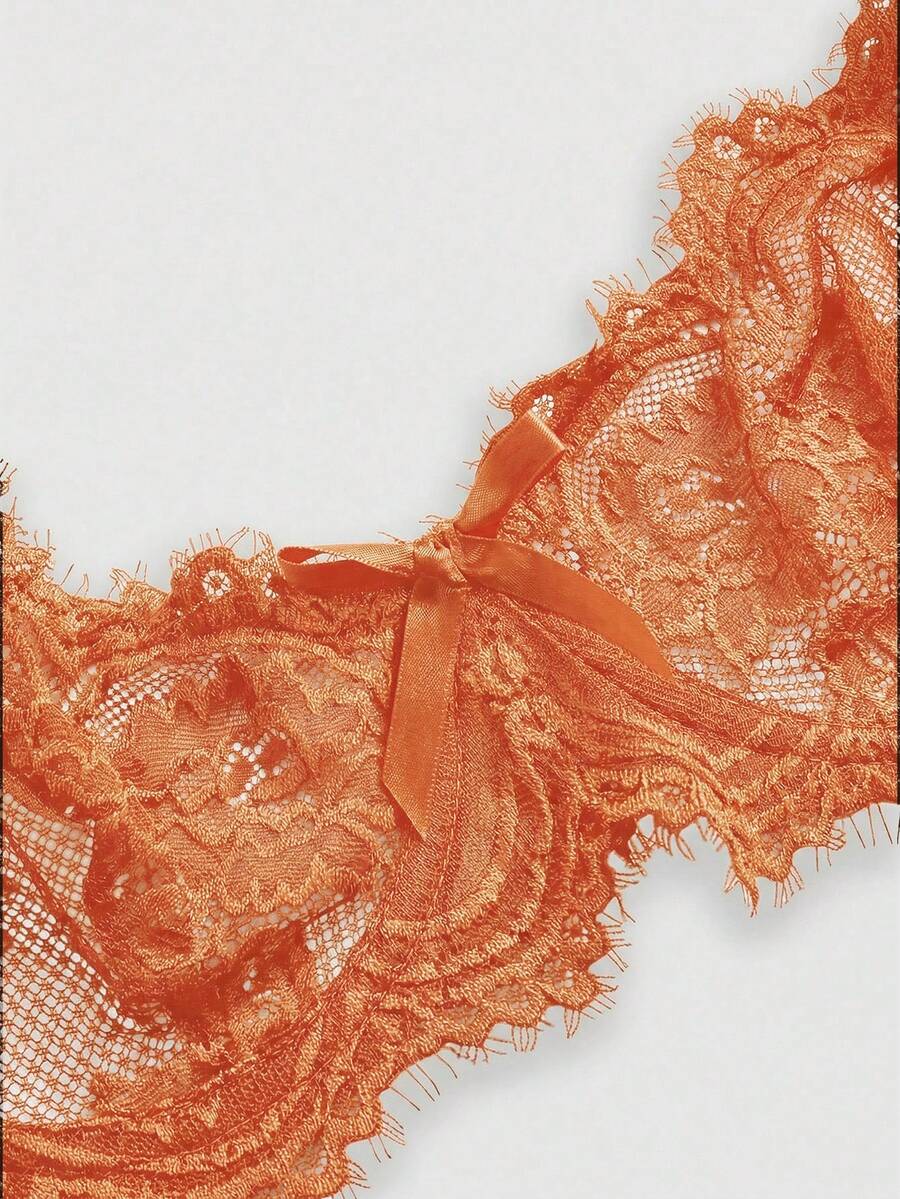 Sheer floral lace underwire triangle bra for women featuring adjustable straps and plunge cup design.