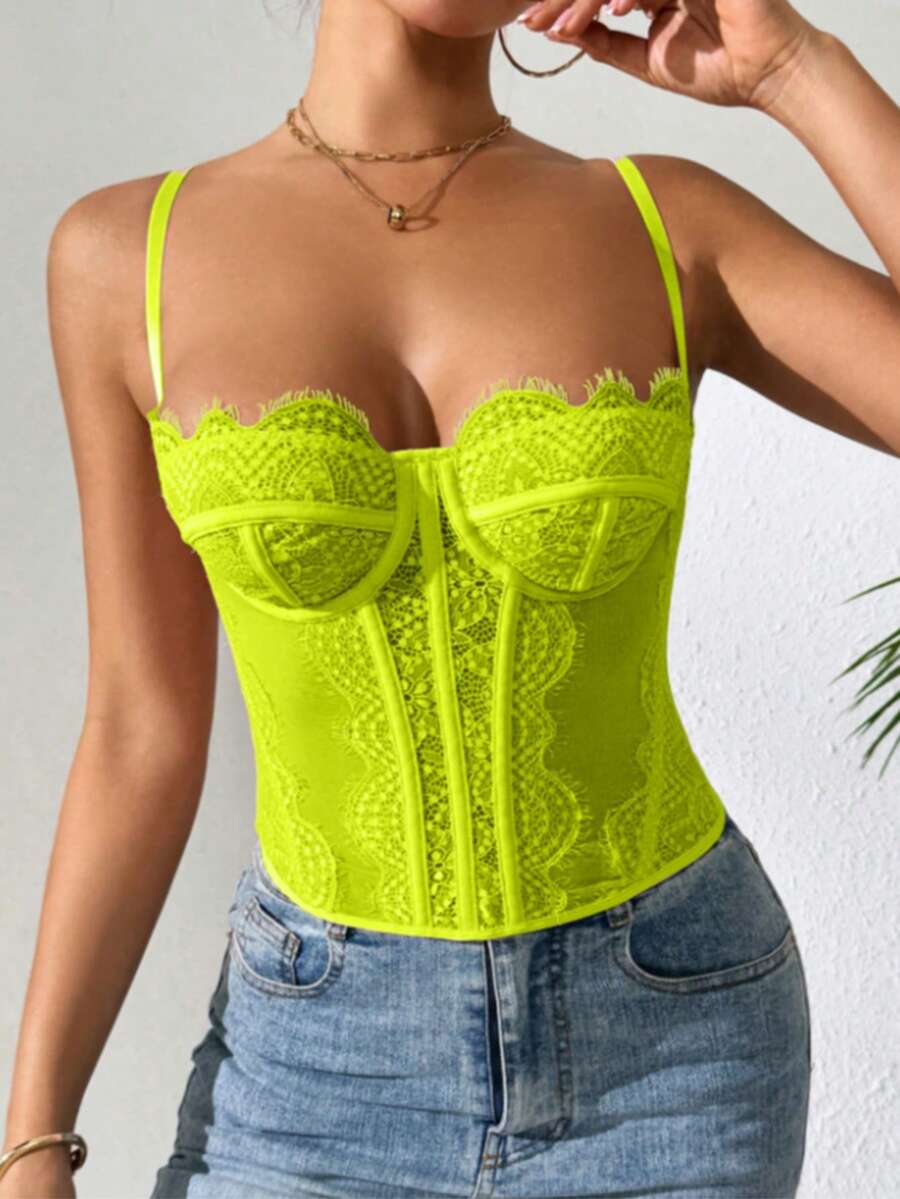Women's lace bustier corset cami top with spaghetti straps, arm sleeves, asymmetrical contrast lace detail, and buckle accent