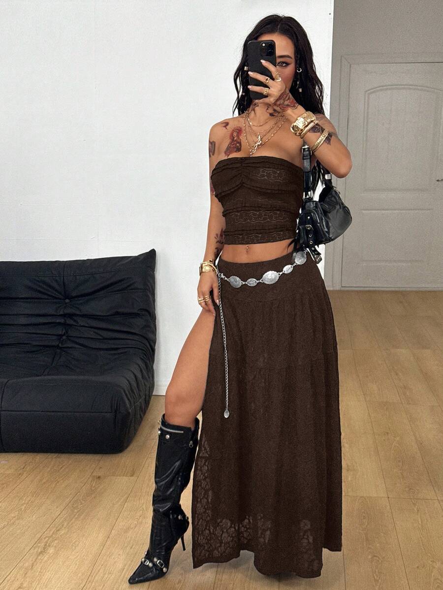 Women's red plaid long skirt featuring a low-rise waist and a side slit in lightweight woven fabric.
