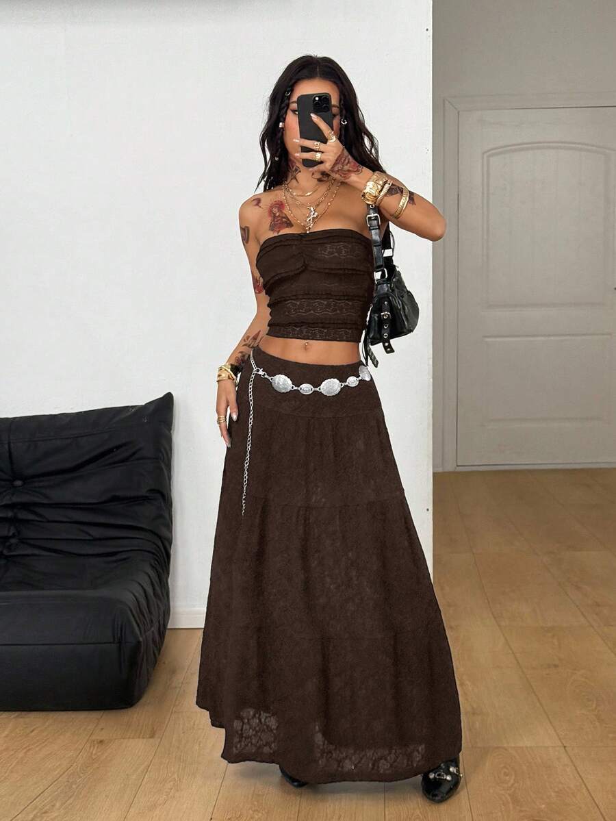 Women's red plaid long skirt featuring a low-rise waist and a side slit in lightweight woven fabric.