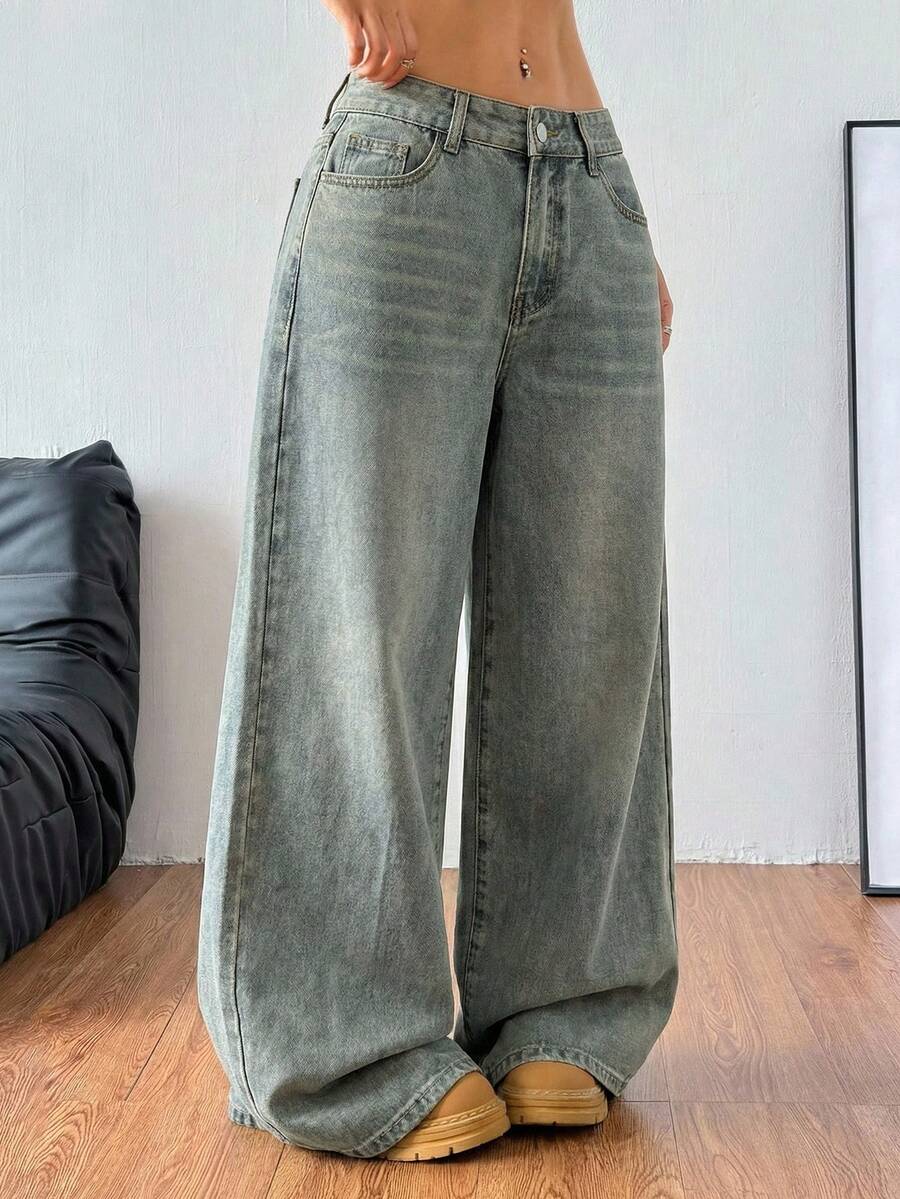 Women's loose wide-leg jeans in light wash denim with low waist and extra-long relaxed fit