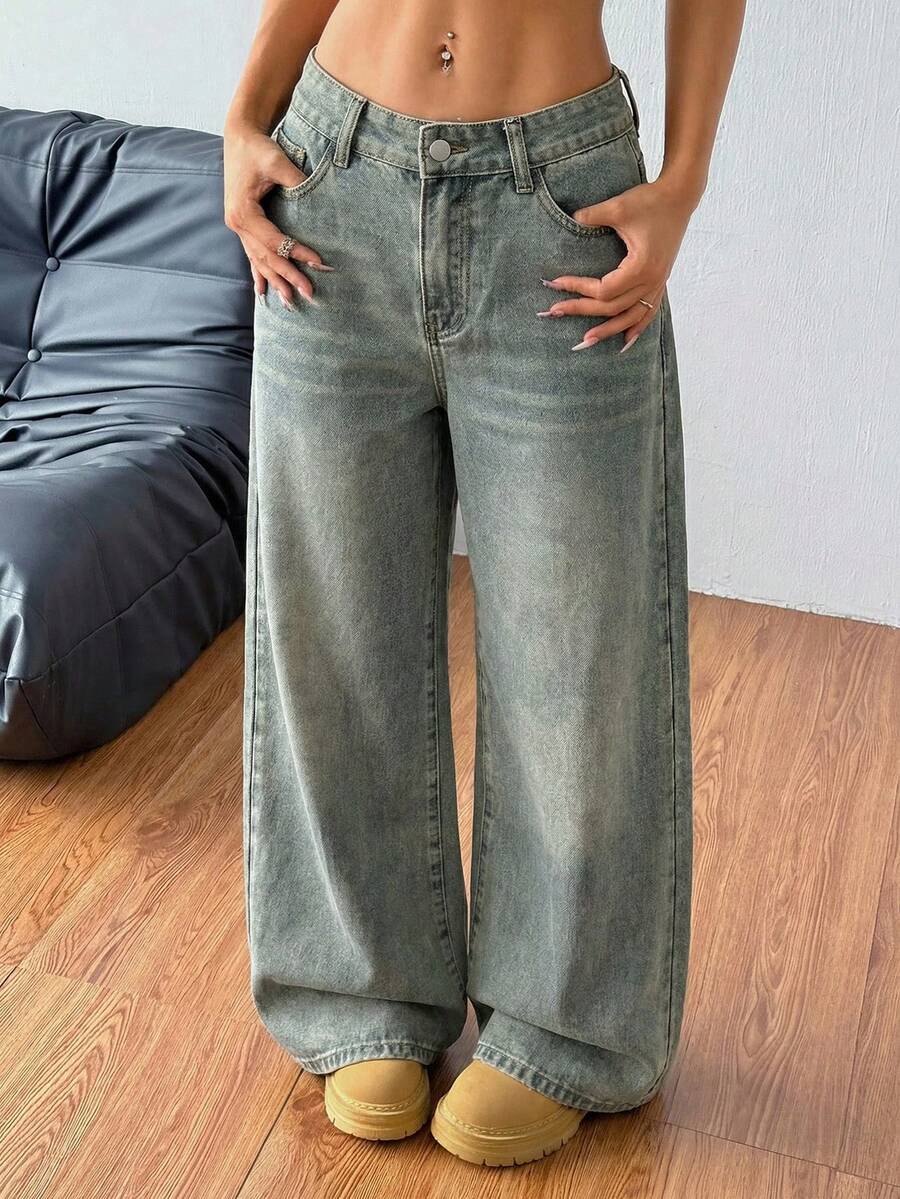 Women's loose wide-leg jeans in light wash denim with low waist and extra-long relaxed fit