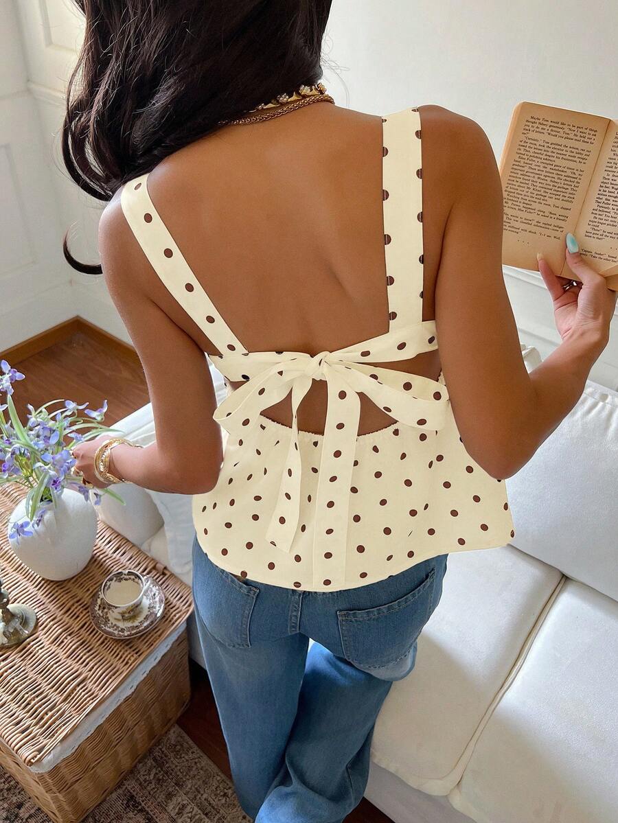 Women's casual polka dot tank top with tie-front knot, strap neckline, backless design, and ruffle flared hem