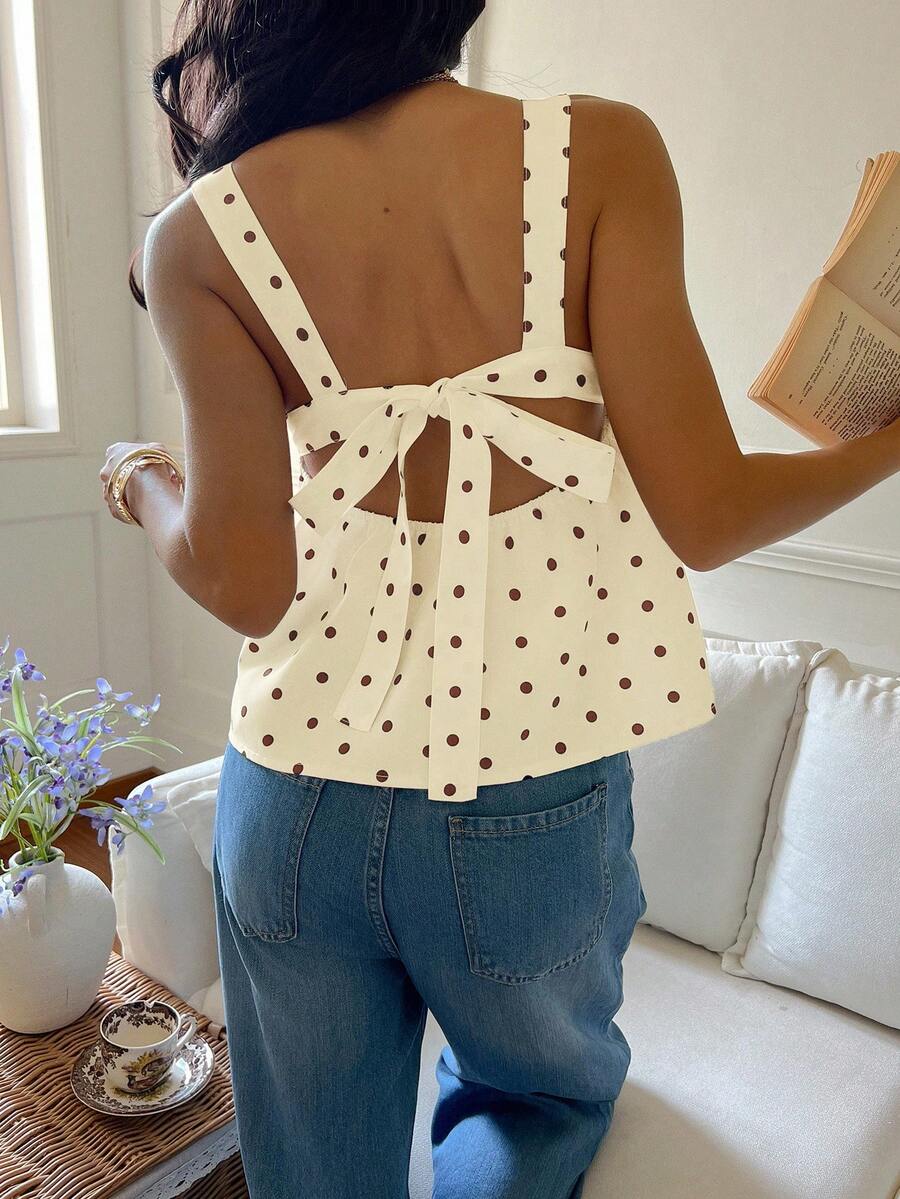 Women's casual polka dot tank top with tie-front knot, strap neckline, backless design, and ruffle flared hem