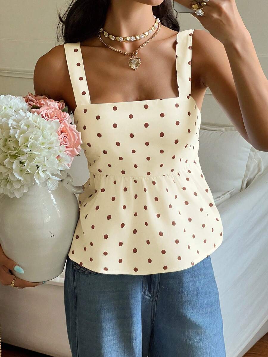 Women's casual polka dot tank top with tie-front knot, strap neckline, backless design, and ruffle flared hem