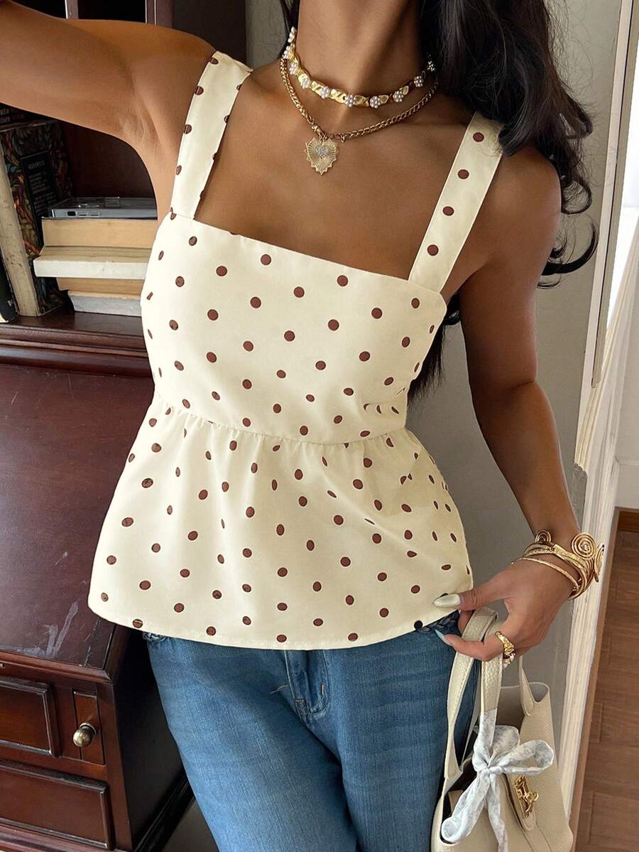 Women's casual polka dot tank top with tie-front knot, strap neckline, backless design, and ruffle flared hem