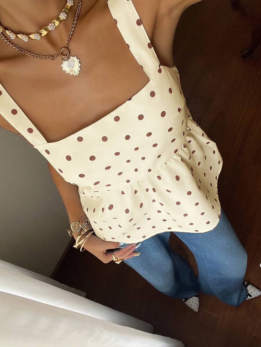 Women's casual polka dot tank top with tie-front knot, strap neckline, backless design, and ruffle flared hem