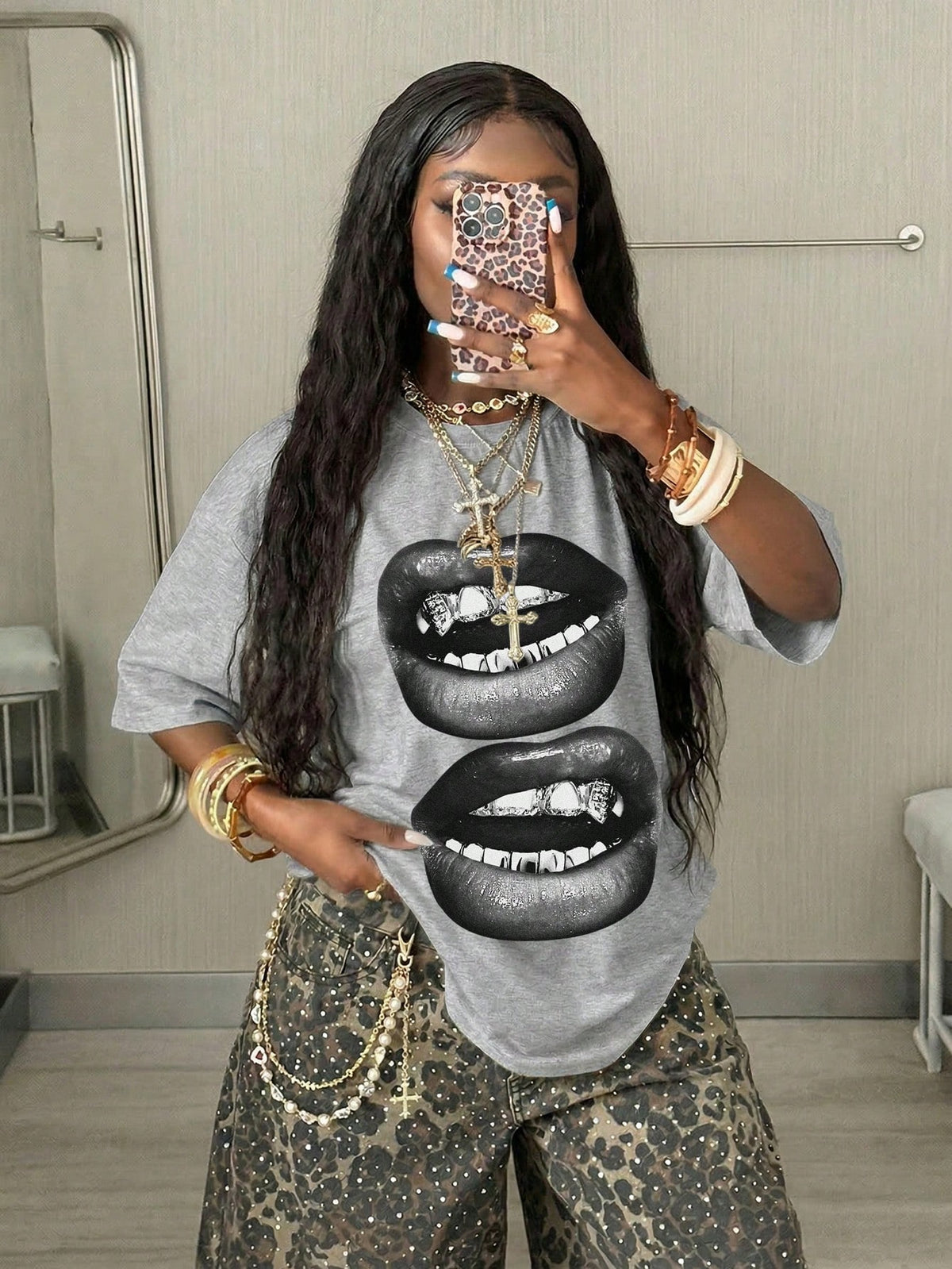 Women's oversized graphic crew neck t-shirt made of 100% white cotton knitted fabric with drop shoulder half sleeves.