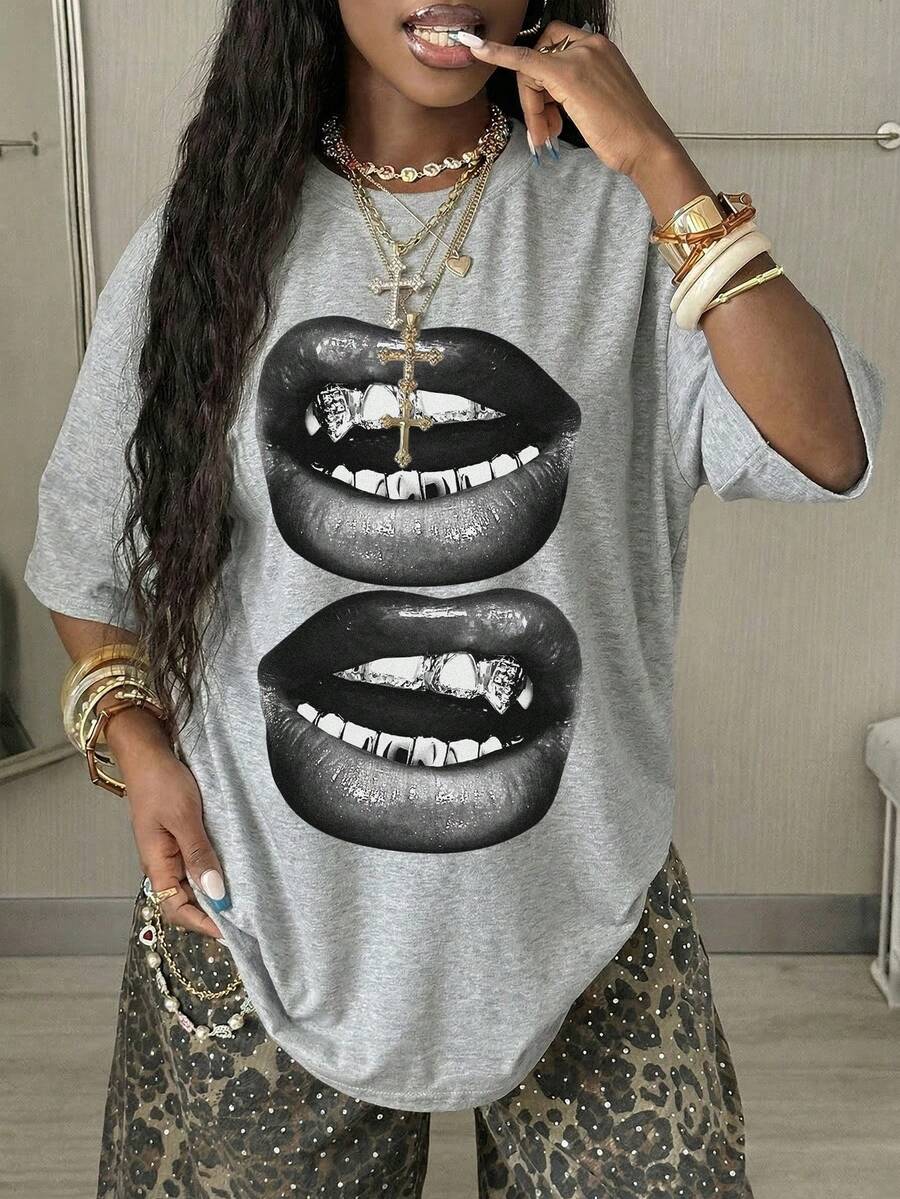 Women's oversized graphic crew neck t-shirt made of 100% white cotton knitted fabric with drop shoulder half sleeves.