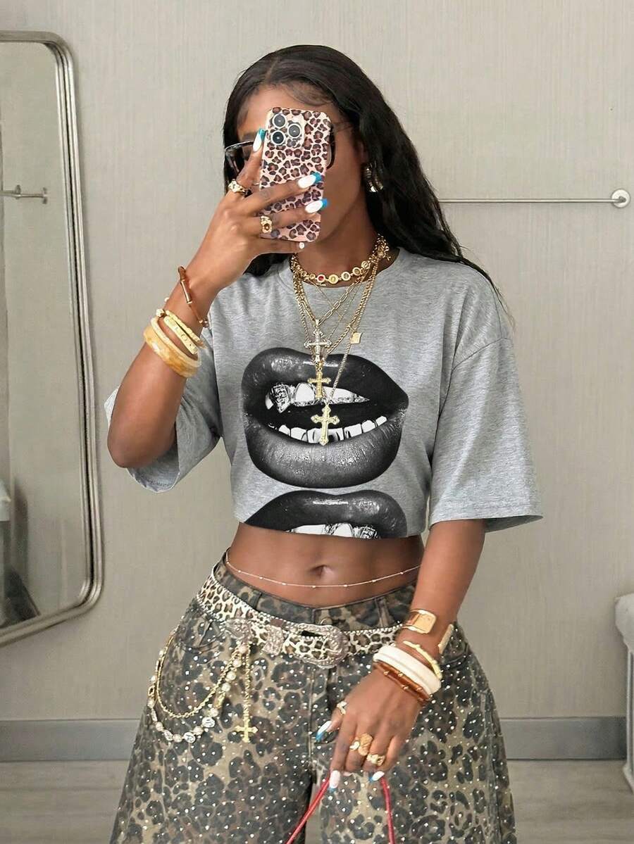 Women's oversized graphic crew neck t-shirt made of 100% white cotton knitted fabric with drop shoulder half sleeves.