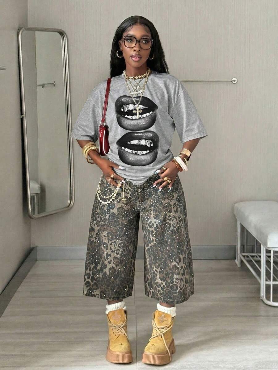 Women's oversized graphic crew neck t-shirt made of 100% white cotton knitted fabric with drop shoulder half sleeves.