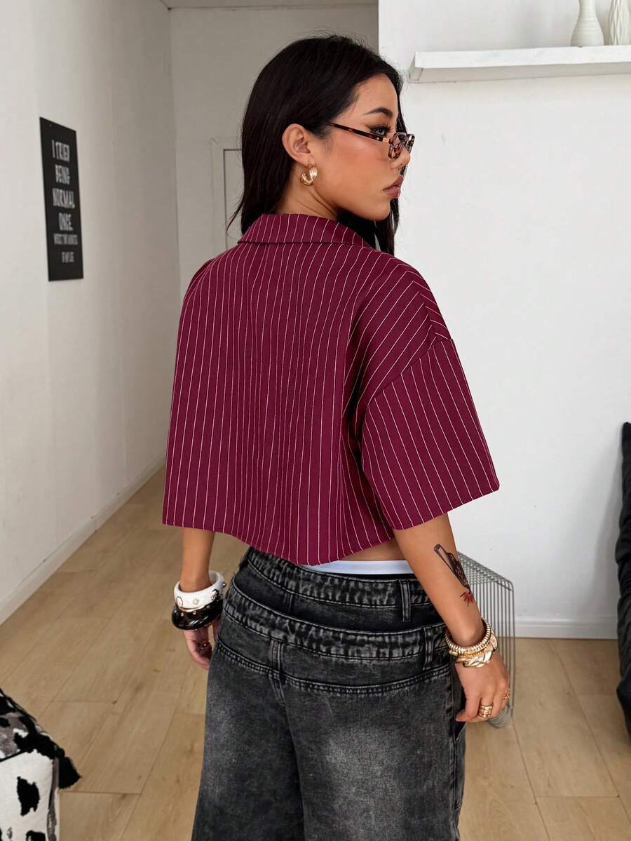 Women's plaid crop shirt with button front, chest pocket, short sleeves, and loose casual fit.