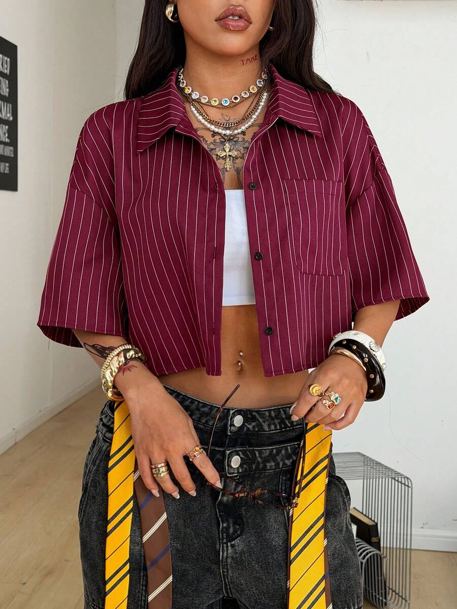 Women's plaid crop shirt with button front, chest pocket, short sleeves, and loose casual fit.