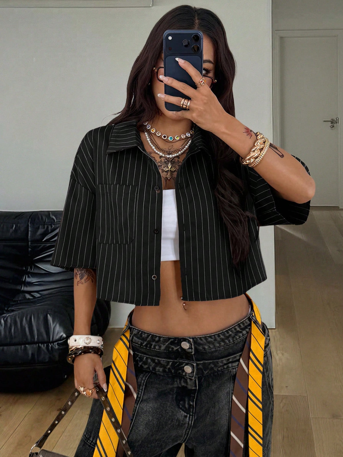 Women's plaid crop shirt with button front, chest pocket, short sleeves, and loose casual fit.