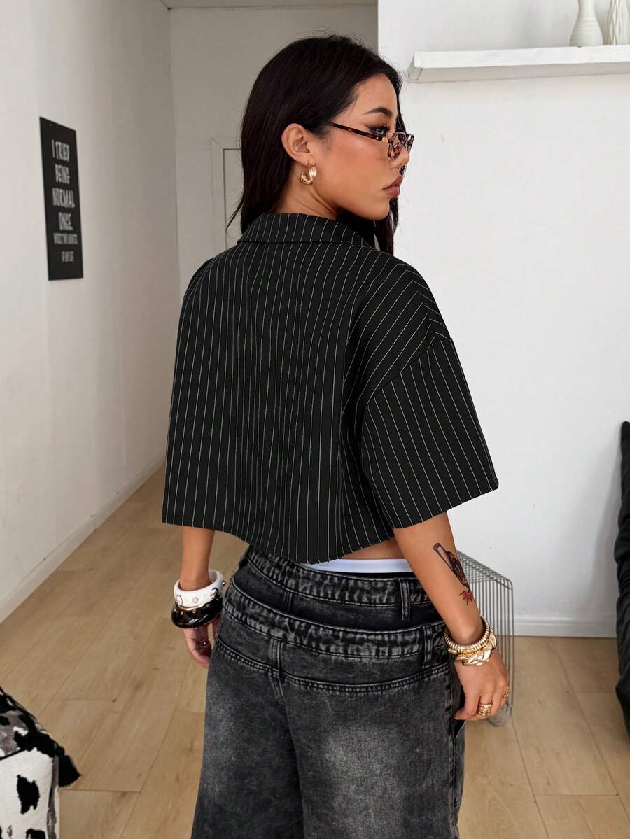 Women's plaid crop shirt with button front, chest pocket, short sleeves, and loose casual fit.