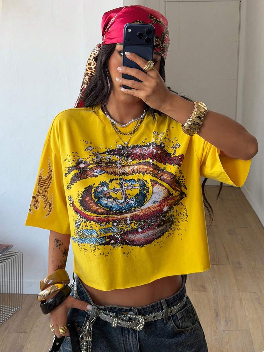 Women's oversized graphic crop t-shirt with short drop shoulder sleeves and round neckline in a streetwear style.