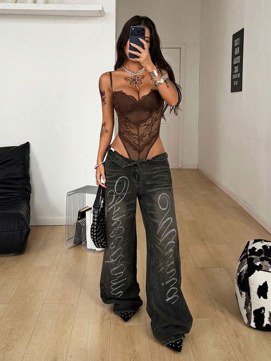 Fitted women's lace and mesh cami bodysuit with spaghetti straps.