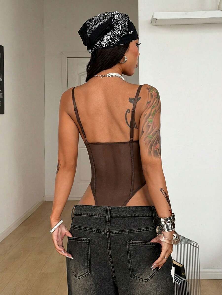 Fitted women's lace and mesh cami bodysuit with spaghetti straps.