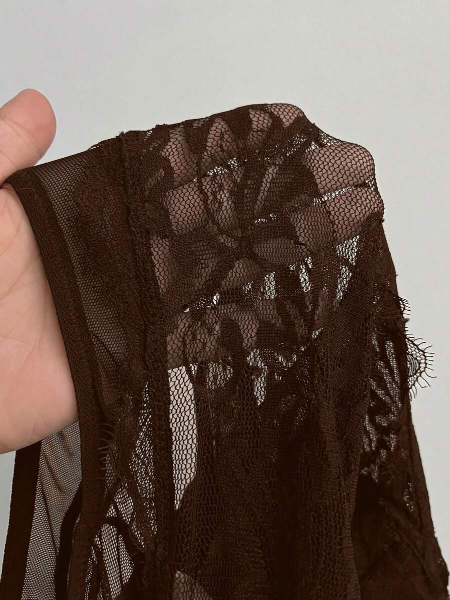 Fitted women's lace and mesh cami bodysuit with spaghetti straps.