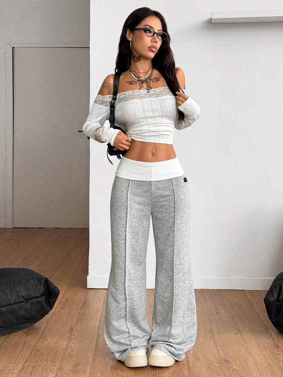 Women's wide leg flare lounge pants made of 95% cotton with a low elastic waistband and extra long hem.