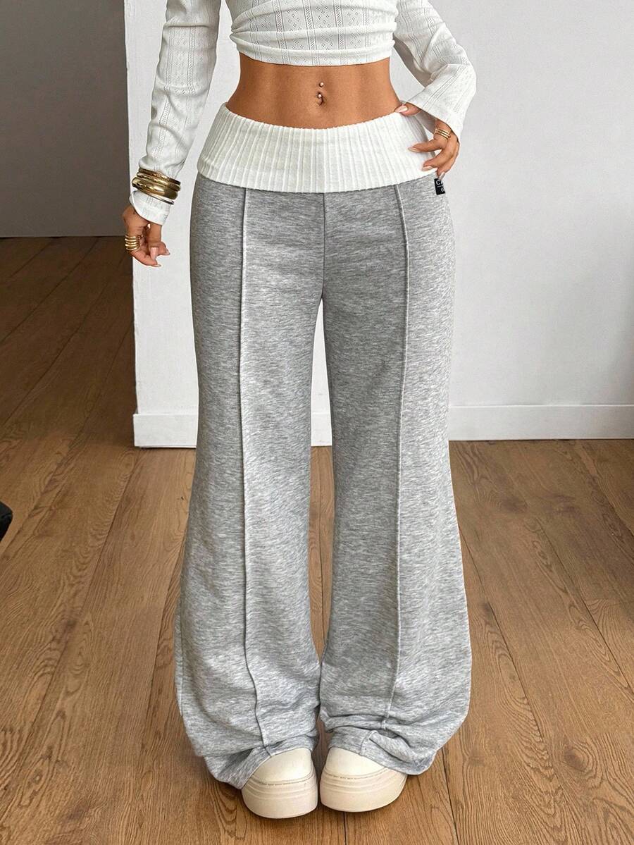 Women's wide leg flare lounge pants made of 95% cotton with a low elastic waistband and extra long hem.