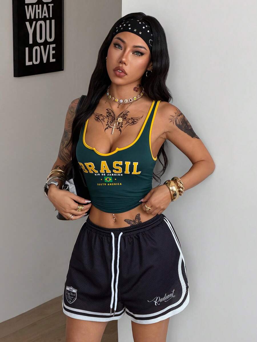 Women's black mesh track shorts featuring a drawstring waist, striped trim, and graphic letter print in a loose mini length.