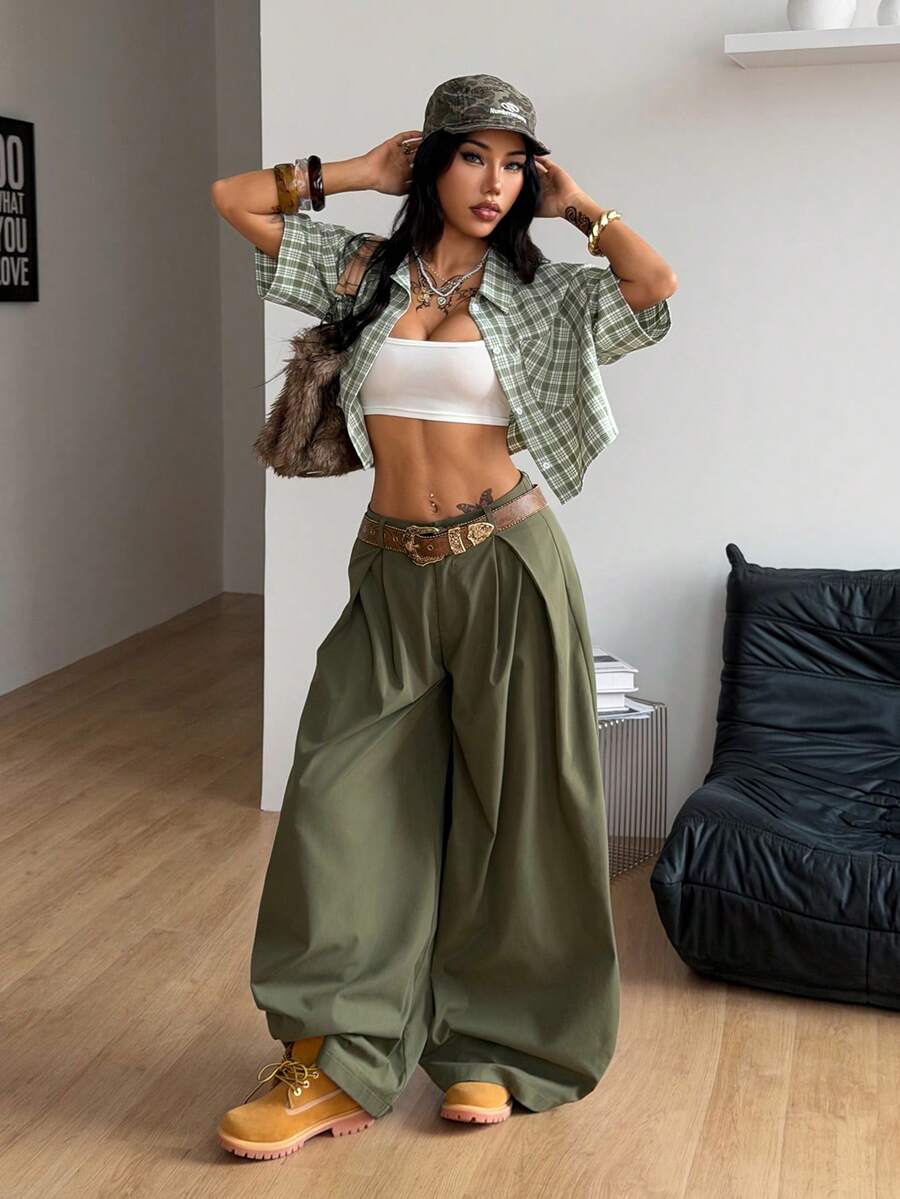 Women's plaid crop shirt with button front, chest pocket, short sleeves, and loose casual fit.