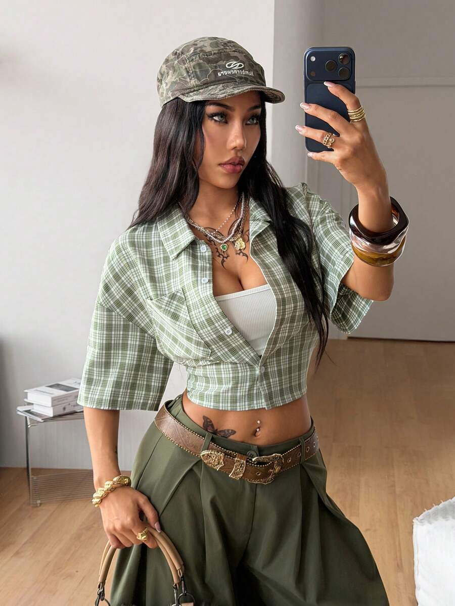 Women's plaid crop shirt with button front, chest pocket, short sleeves, and loose casual fit.