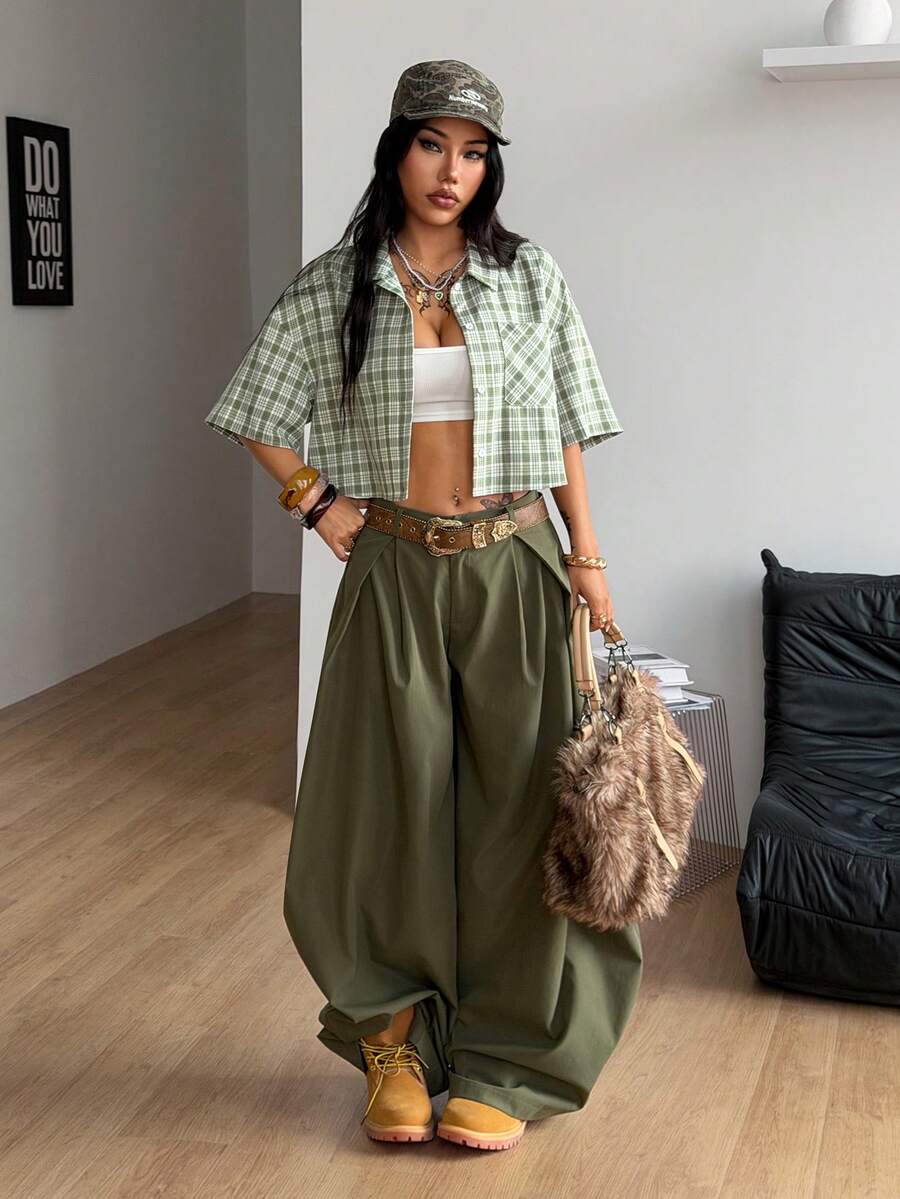 Women's plaid crop shirt with button front, chest pocket, short sleeves, and loose casual fit.