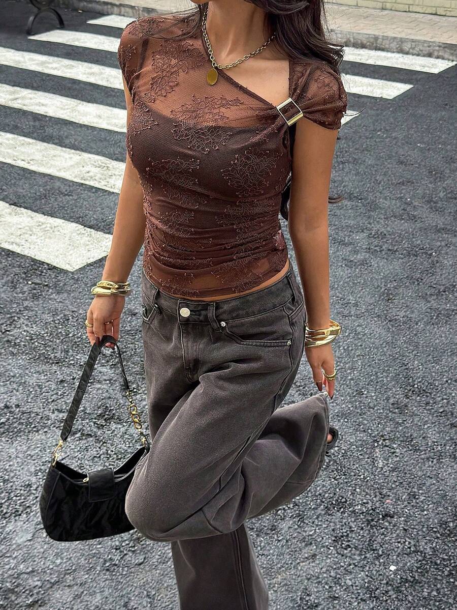 Women's brown short-sleeved top featuring an asymmetric neck, ruched slim-fit silhouette, semi-sheer mesh details, and plant pattern design.