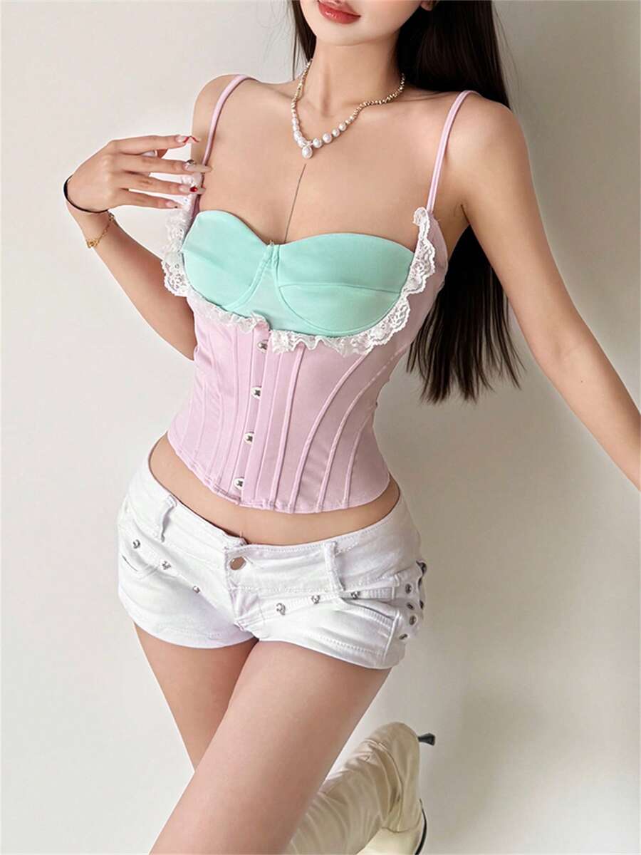 Pink women's boned crop cami top with adjustable spaghetti straps and an asymmetrical hem.