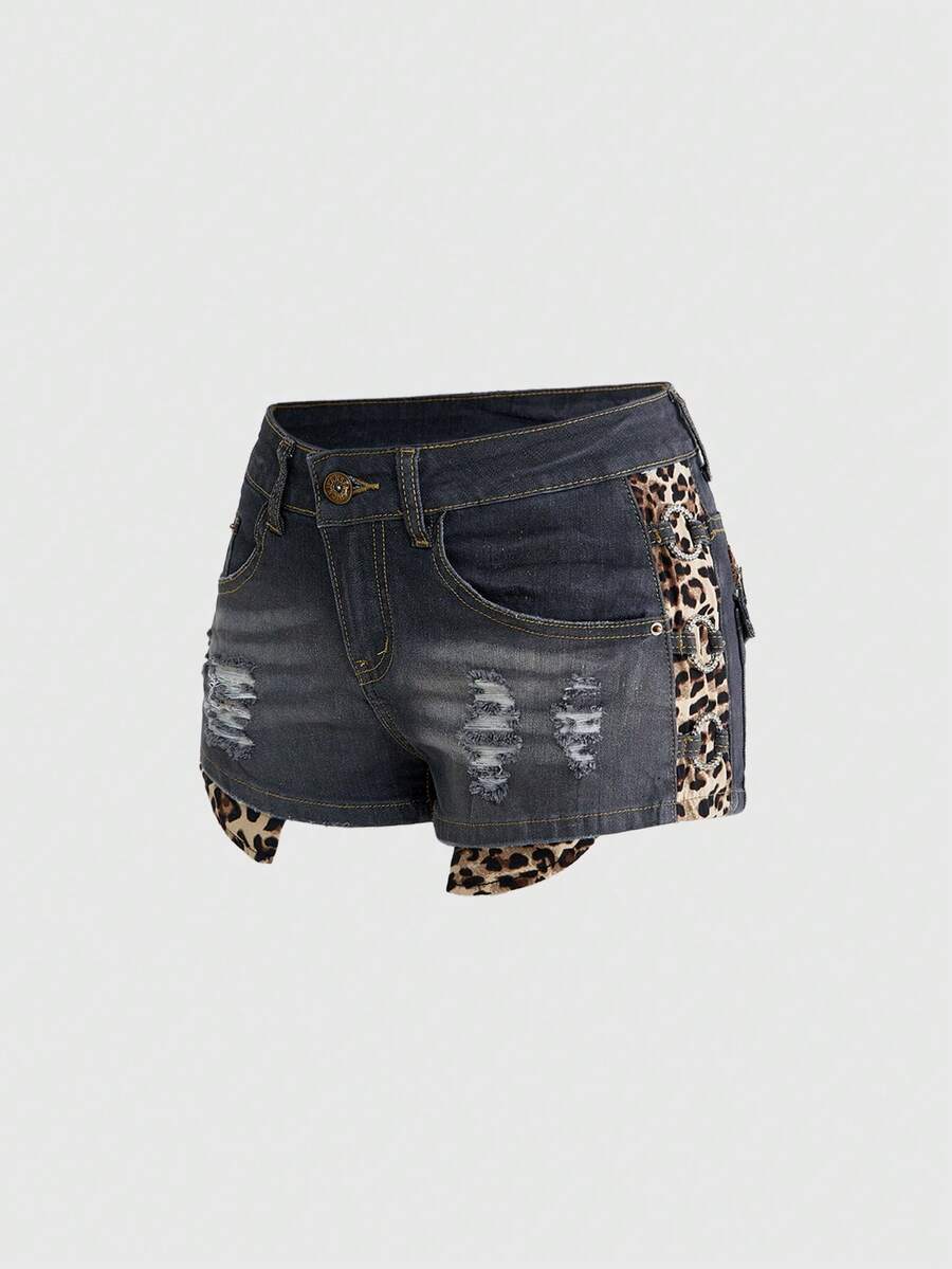 Women's ultra low waist vintage Y2K leopard print skinny mini shorts featuring ripped details, button, and zipper fly.