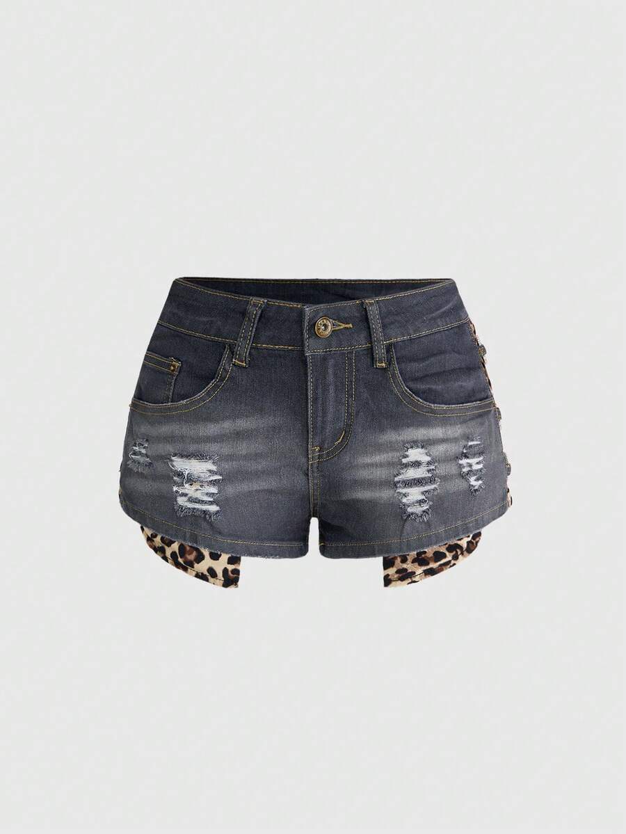 Women's ultra low waist vintage Y2K leopard print skinny mini shorts featuring ripped details, button, and zipper fly.