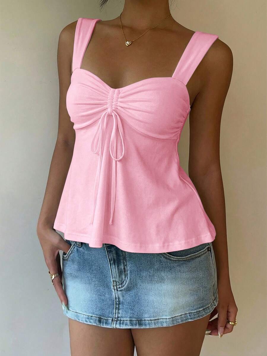 Women's white wide strap tank top with drawstring front, eyelet embroidery, ruffle hem, slim fit, and flared hem.