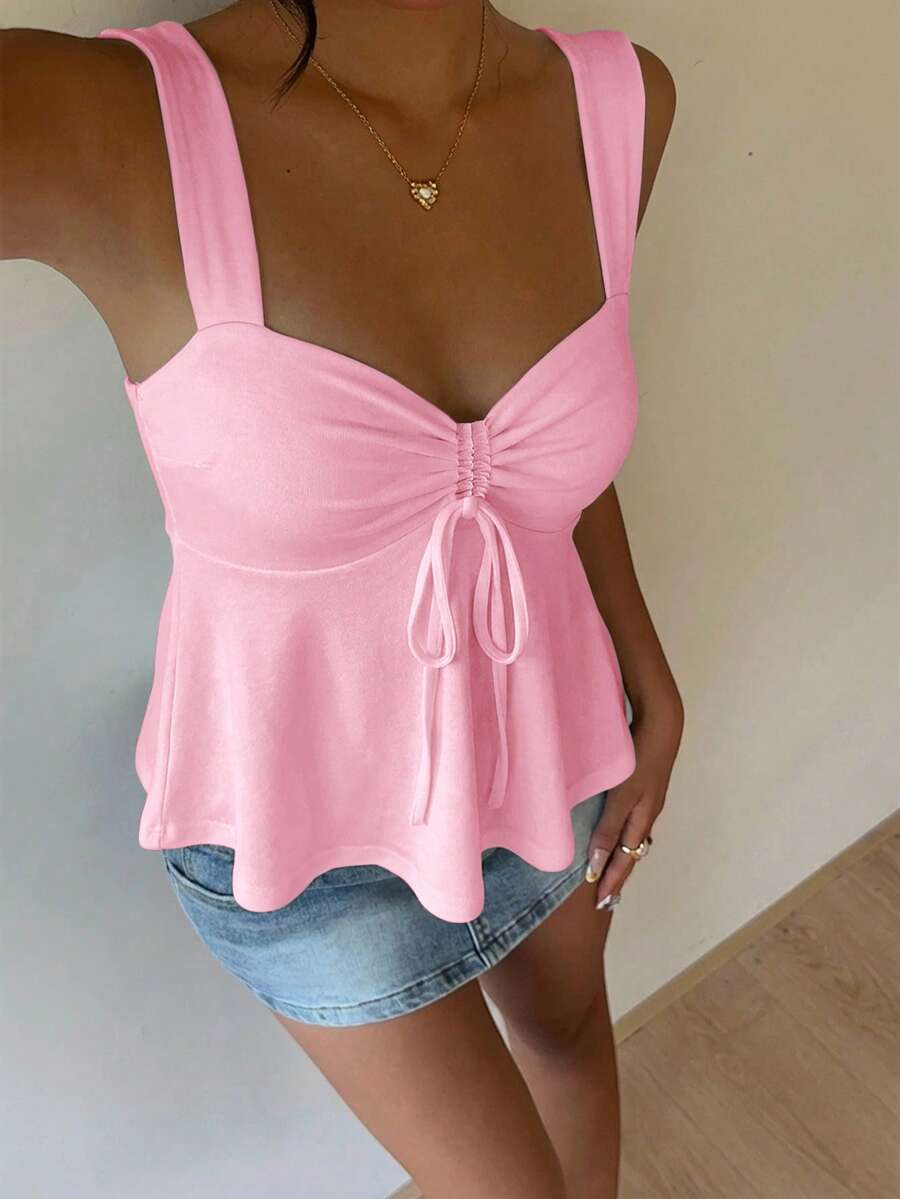 Women's white wide strap tank top with drawstring front, eyelet embroidery, ruffle hem, slim fit, and flared hem.