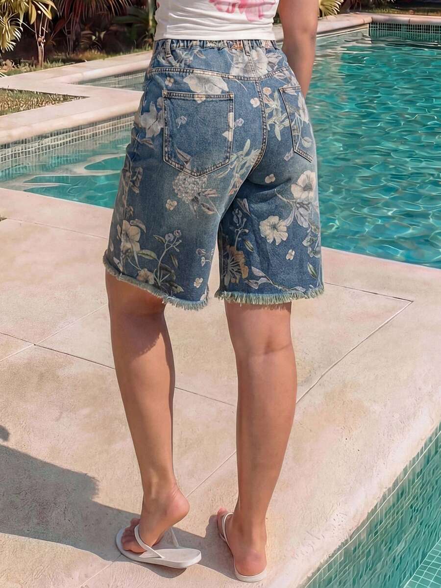 Women's loose wide-leg denim Bermuda shorts featuring vintage animal and paisley print with pockets and zipper fly.