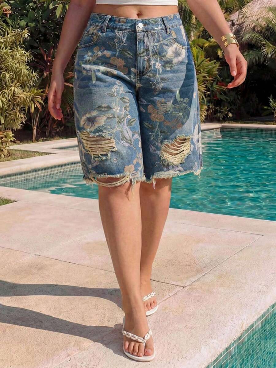 Women's loose wide-leg denim Bermuda shorts featuring vintage animal and paisley print with pockets and zipper fly.
