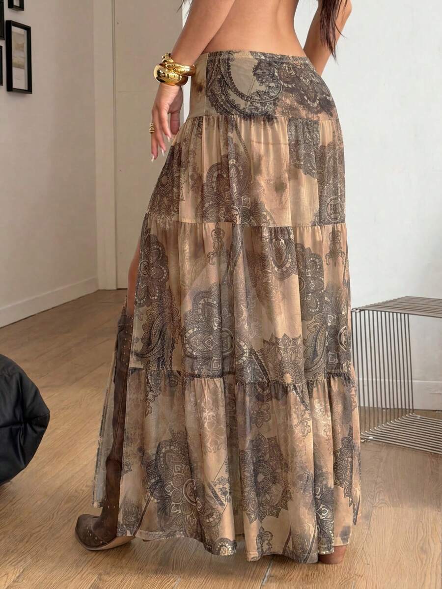 Women's low rise flared long skirt featuring an all-over print, split thigh accent, and textured semi-sheer fabric.