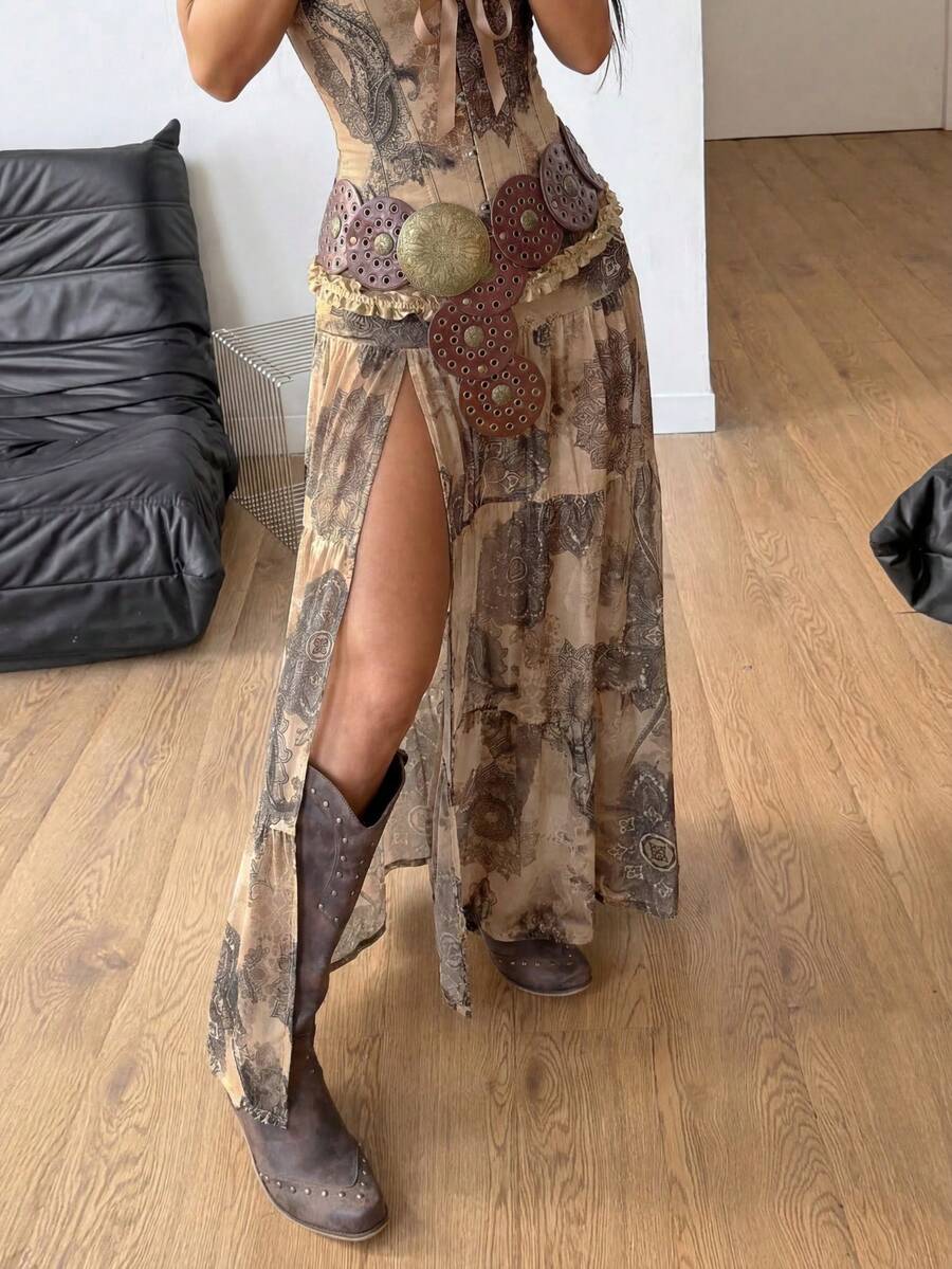 Women's low rise flared long skirt featuring an all-over print, split thigh accent, and textured semi-sheer fabric.