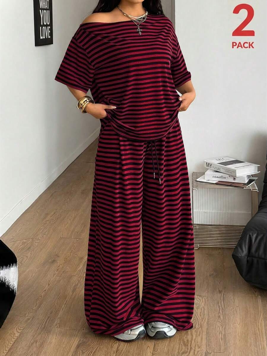 Women's casual two-piece outfit featuring a loose short-sleeve asymmetrical neck t-shirt and matching long wide leg pants with pockets.