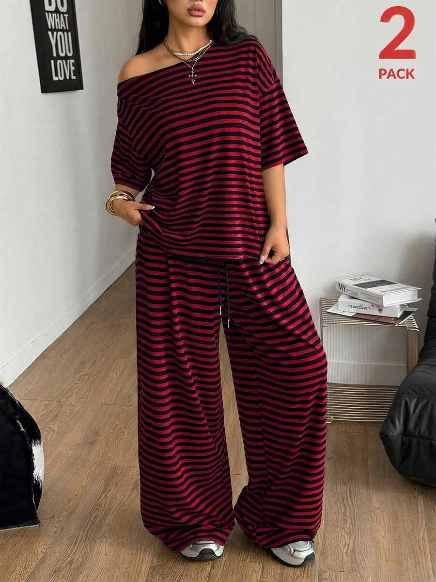Women's casual two-piece outfit featuring a loose short-sleeve asymmetrical neck t-shirt and matching long wide leg pants with pockets.