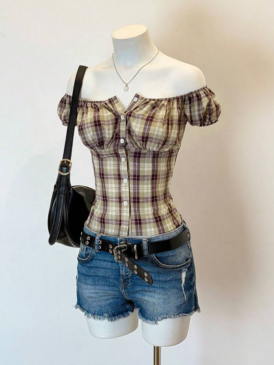 Women's army green plaid off-the-shoulder shirt with short puff sleeves, front button closure, flared hem, and lace-up grommet eyelet details.