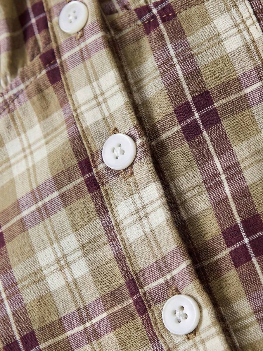 Women's army green plaid off-the-shoulder shirt with short puff sleeves, front button closure, flared hem, and lace-up grommet eyelet details.
