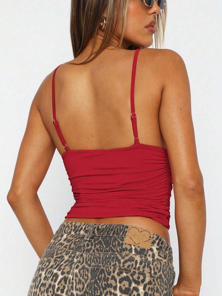 Women's red V-neck backless cami crop top with ruched details in a slim fit knitted style.