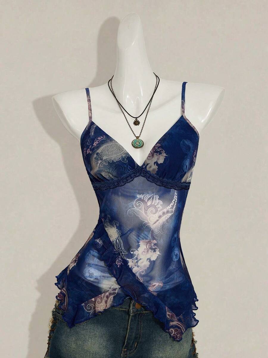 Women's graphic print camisole top featuring thin spaghetti straps, a backless cut, and an asymmetrical hem.