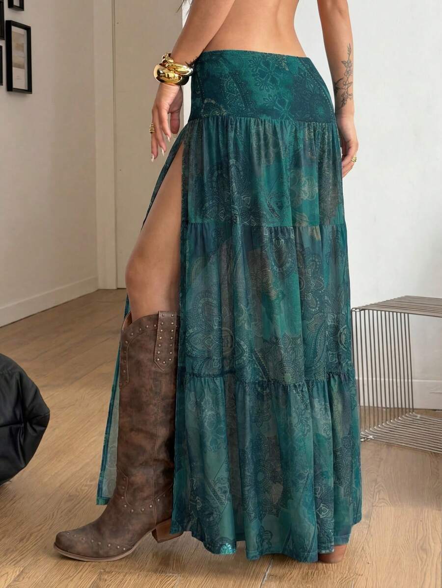 Women's low rise flared long skirt featuring an all-over print, split thigh accent, and textured semi-sheer fabric.
