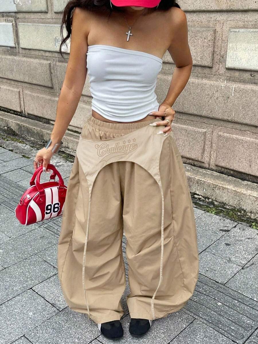 Women's casual wide leg long pants featuring an elastic drawstring waistband and loose fit silhouette.
