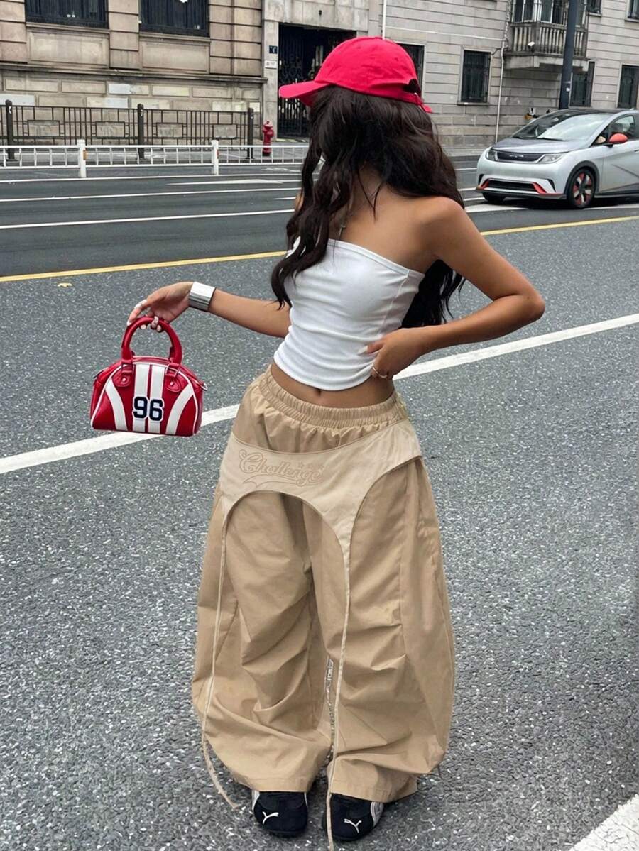 Women's casual wide leg long pants featuring an elastic drawstring waistband and loose fit silhouette.